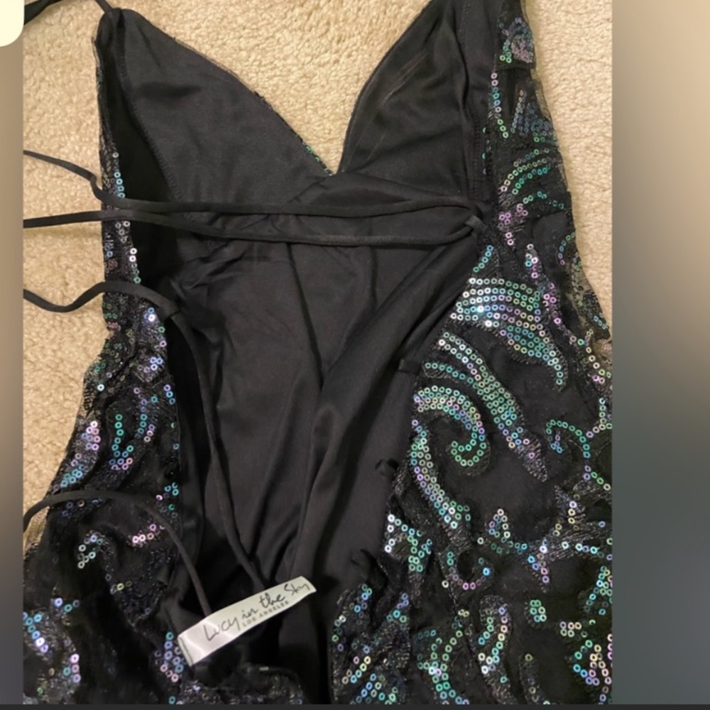 Iridescent and short black dress, never worn and brand new. size 2